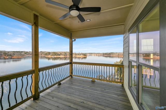 exterior space with a water view and ceiling fan