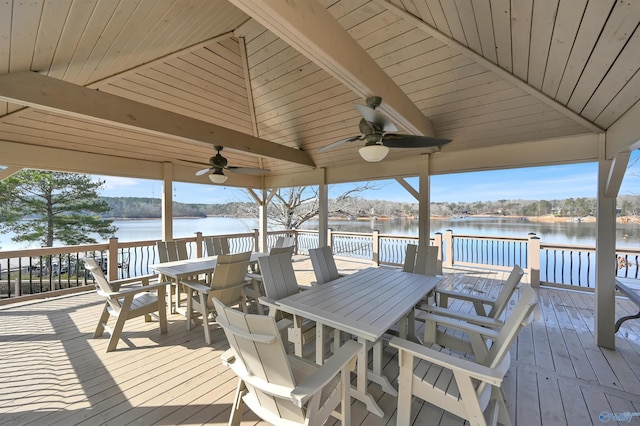 wooden terrace with ceiling fan and a water view