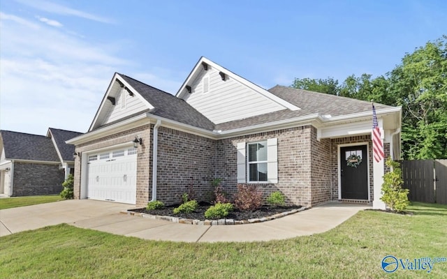 6527 Oak Meadow Dr SE, Owens Cross Roads, AL 35763 - view of front of house featuring brick siding, a garage, concrete driveway, and a shingled roof