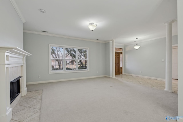 unfurnished living room featuring decorative columns, a tiled fireplace, crown molding, and light carpet