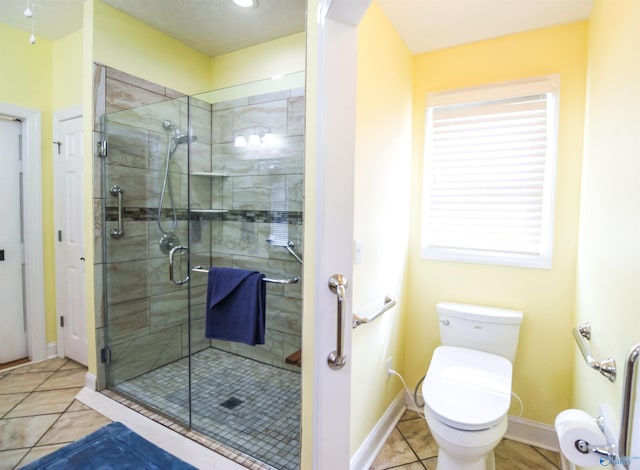 bathroom featuring walk in shower, tile patterned flooring, and toilet