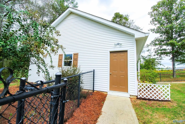 doorway to property featuring a yard