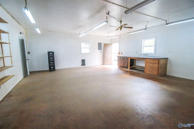 garage with ceiling fan and electric panel