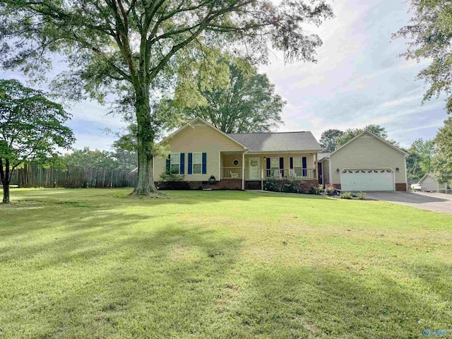 535 10th St NW, Arab, AL 35016 - ranch-style home with asphalt driveway, a front yard, covered porch, and a garage