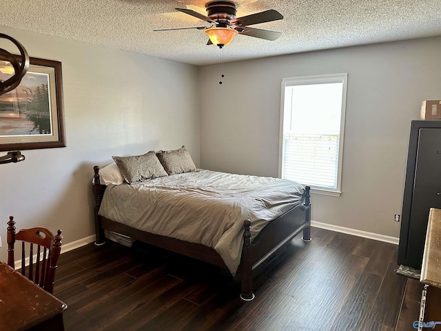 535 10th St NW, Arab, AL 35016 - bedroom with baseboards, dark wood-style flooring, a textured ceiling, and ceiling fan