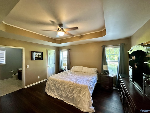 535 10th St NW, Arab, AL 35016 - bedroom with dark wood-style floors, a tray ceiling, crown molding, a ceiling fan, and baseboards