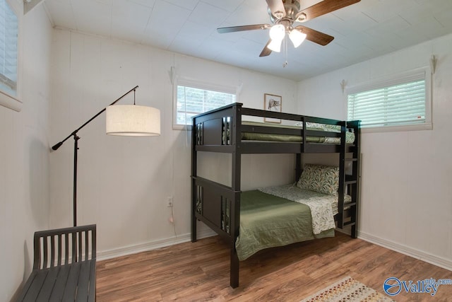 7615 Scottsboro Hwy, Scottsboro, AL 35769 - bedroom with a ceiling fan, wood finished floors, and baseboards