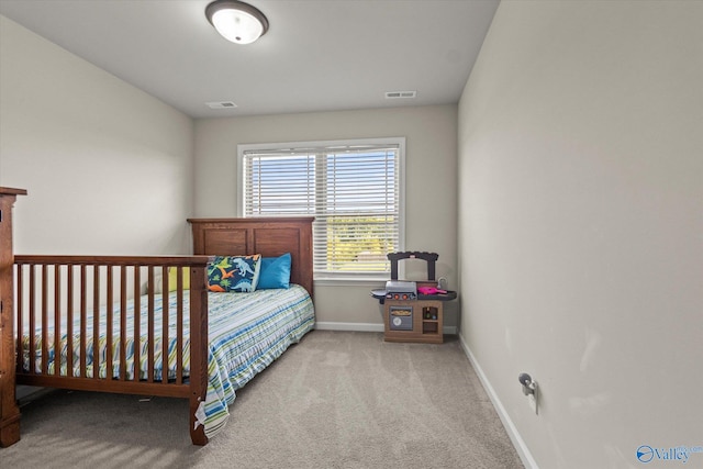 bedroom featuring light colored carpet