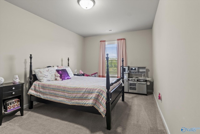 bedroom with light colored carpet