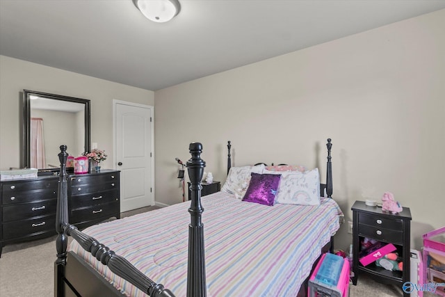 bedroom featuring light carpet