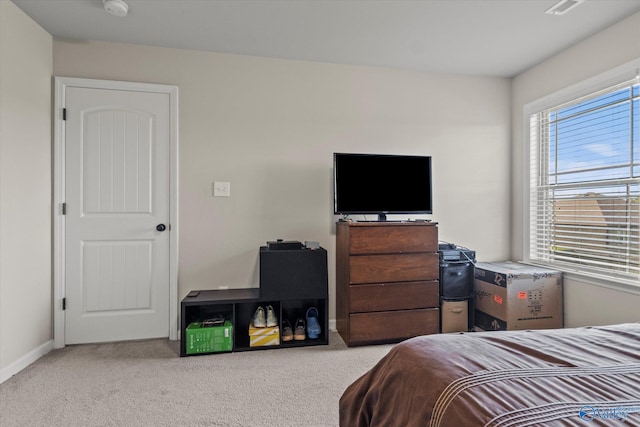 bedroom with light carpet