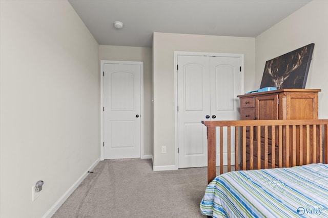 carpeted bedroom featuring a closet