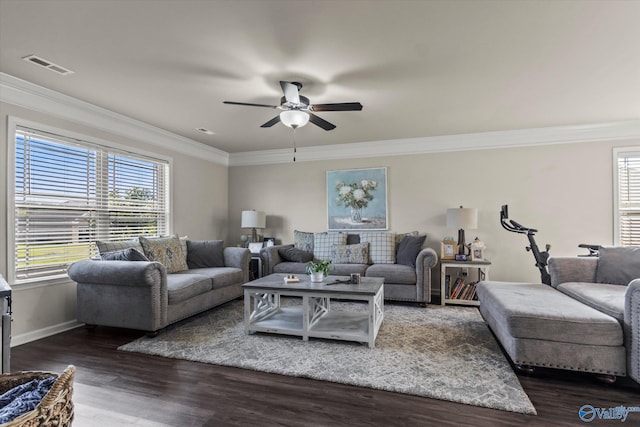 living room with dark hardwood / wood-style flooring, ornamental molding, and ceiling fan