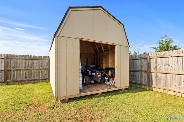 view of outbuilding featuring a lawn