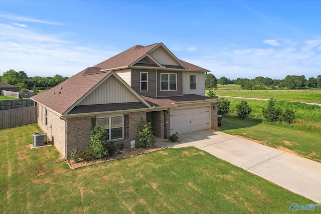 craftsman-style home featuring central air condition unit and a front yard