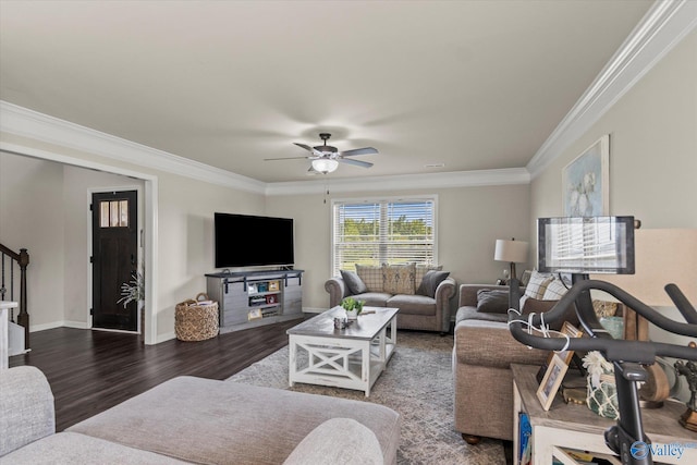 living room featuring dark hardwood / wood-style floors, ornamental molding, and ceiling fan