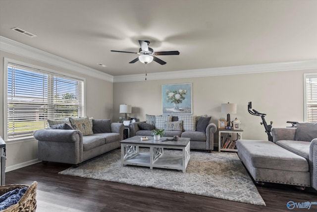 living room featuring ceiling fan, ornamental molding, and dark hardwood / wood-style flooring