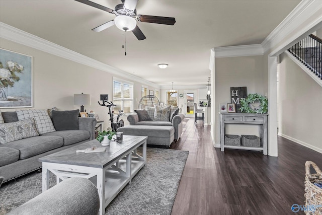 living room with dark hardwood / wood-style flooring, ornamental molding, and ceiling fan