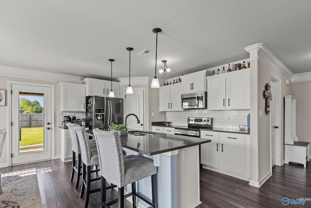 kitchen with white cabinetry, backsplash, dark hardwood / wood-style flooring, appliances with stainless steel finishes, and sink