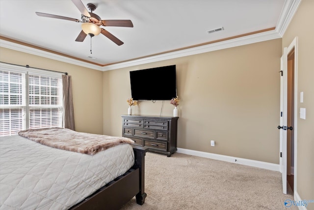 bedroom featuring a ceiling fan, visible vents, baseboards, ornamental molding, and carpet