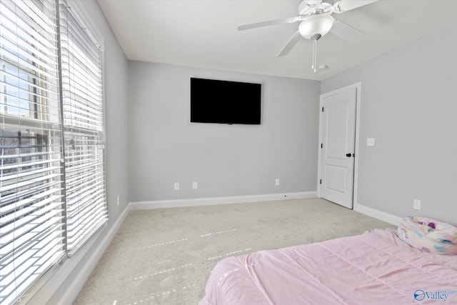 bedroom with carpet floors, ceiling fan, and baseboards