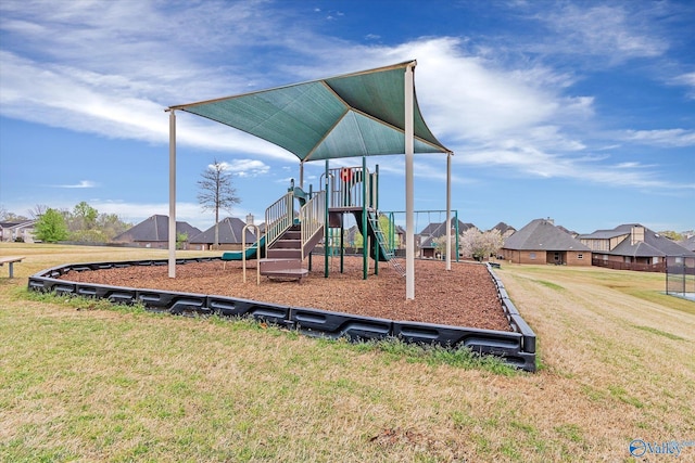 community jungle gym with a lawn