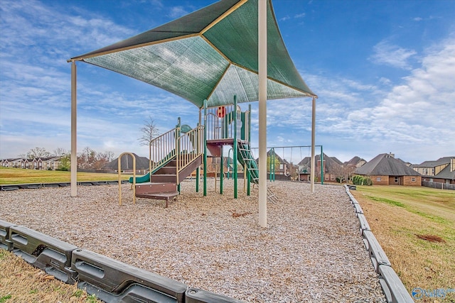 community play area featuring a lawn