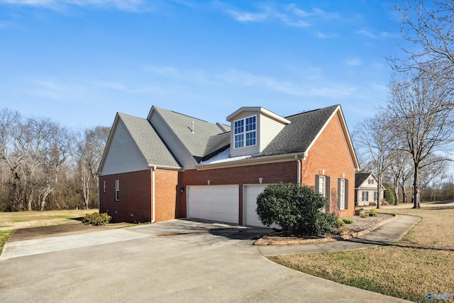 view of property exterior featuring a garage, brick siding, driveway, and a shingled roof