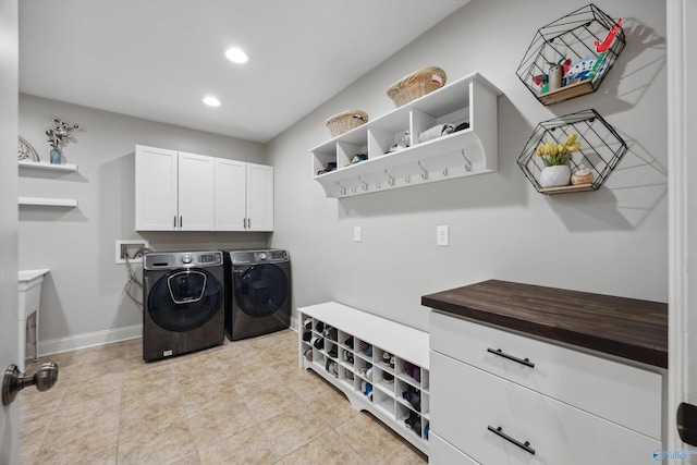 washroom featuring baseboards, washing machine and dryer, light tile patterned floors, recessed lighting, and cabinet space