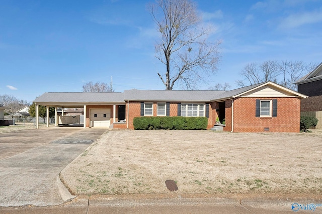 ranch-style house featuring brick siding, a carport, a garage, crawl space, and driveway