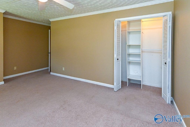 unfurnished bedroom with carpet flooring, baseboards, and ornamental molding