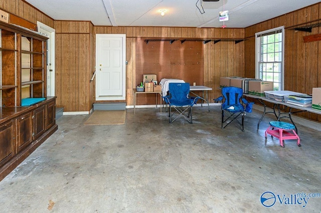 garage featuring wood walls