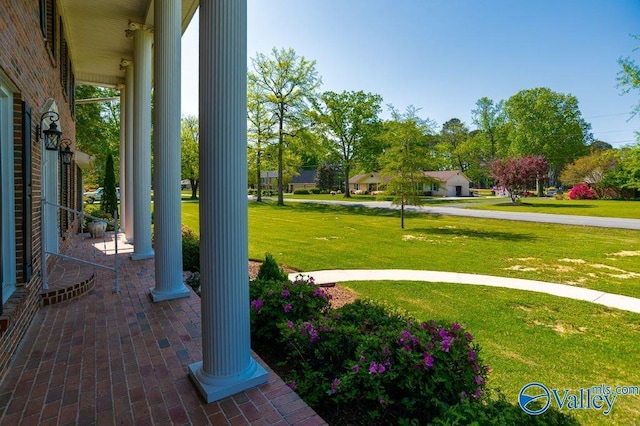 view of yard with covered porch