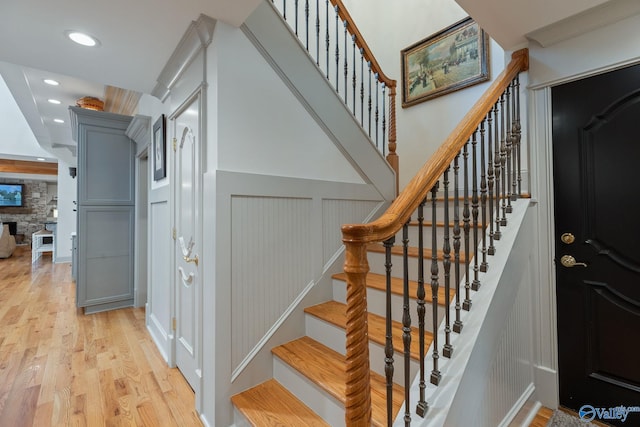 stairs featuring wood-type flooring