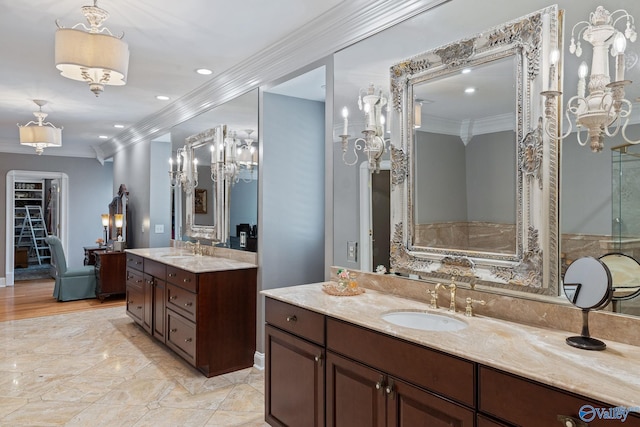 bathroom with ornamental molding and vanity