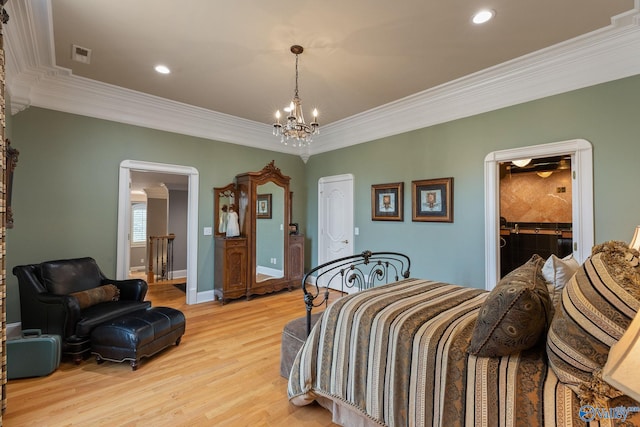 bedroom featuring light hardwood / wood-style flooring, a chandelier, and crown molding