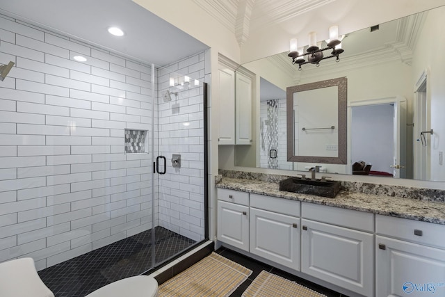 bathroom with ornamental molding, vanity, tile patterned floors, and walk in shower