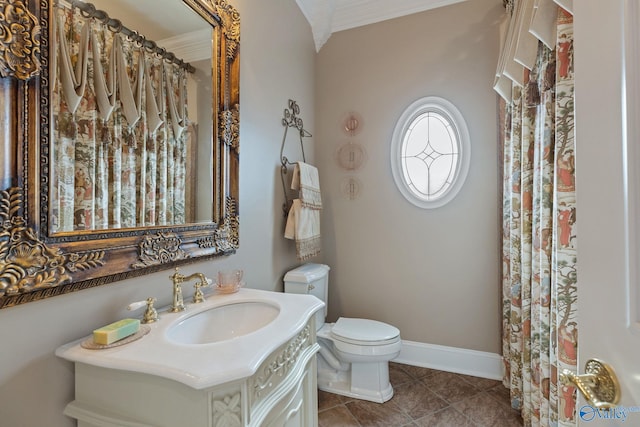 bathroom featuring ornamental molding, vanity, tile patterned flooring, and toilet