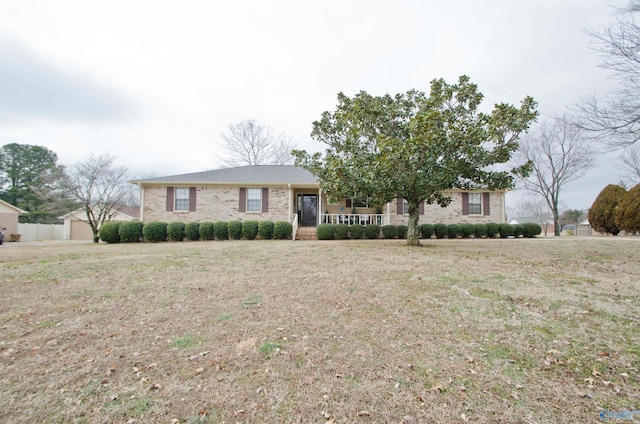 ranch-style house with a front lawn