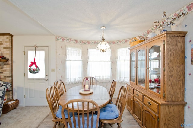 dining area with a textured ceiling