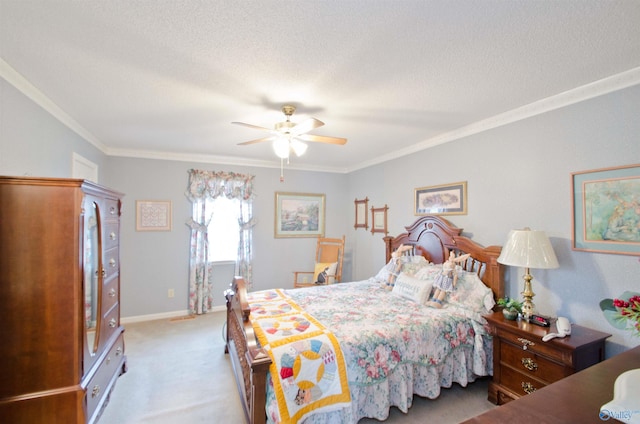 carpeted bedroom featuring ceiling fan, ornamental molding, and a textured ceiling