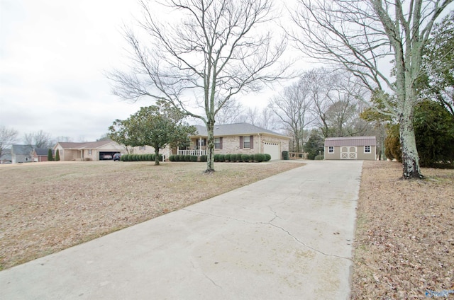 view of front of home with an outbuilding and a front yard