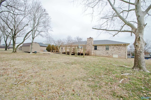 view of yard with a wooden deck