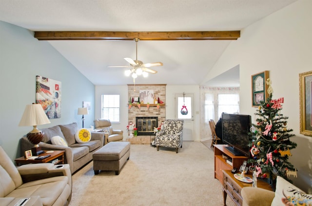 living room with a healthy amount of sunlight, a brick fireplace, lofted ceiling with beams, and light carpet