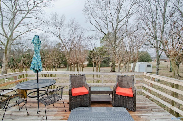 wooden terrace featuring a storage shed