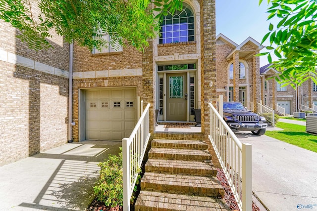 doorway to property with a garage