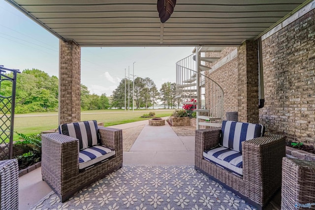 view of patio / terrace featuring an outdoor living space with a fire pit