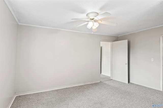 unfurnished room with crown molding, a textured ceiling, carpet, and ceiling fan