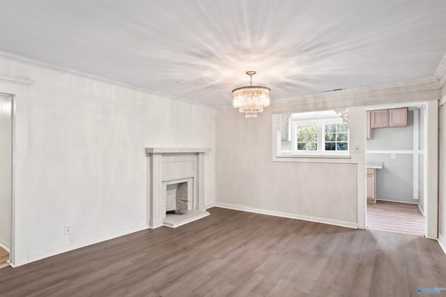 unfurnished living room with crown molding, a chandelier, and dark hardwood / wood-style flooring