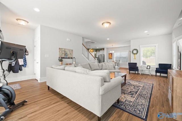 9130 Monteagle Blvd, Owens Cross Roads, AL 35763 - living room featuring stairs, wood finished floors, baseboards, and recessed lighting